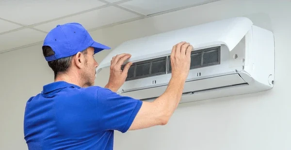 Homepage 10 hvac technician performing air conditioner 600nw 2488702851 e1749634785391